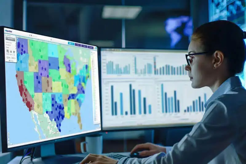 Data analyst on a computer using eSpatial