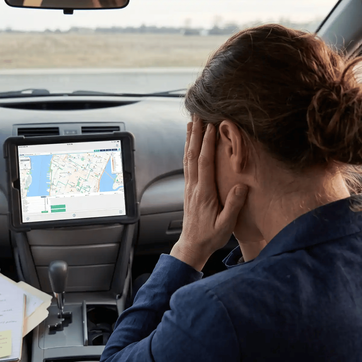 Woman stressed looking a a route map